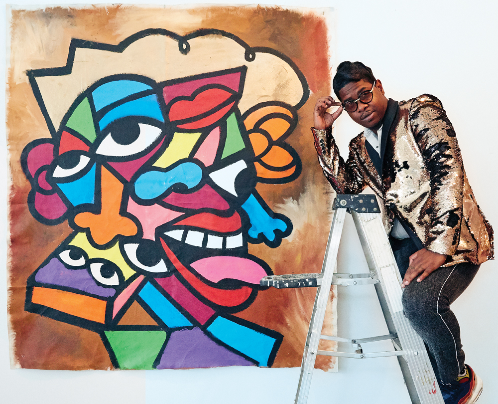 Turner poses in front of his abstract mural at Camilo Pardo's studio in Detroit.