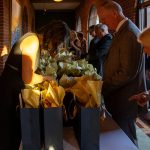 Attendees pick up gift bags before the 2025 Igniting Our Future Gala