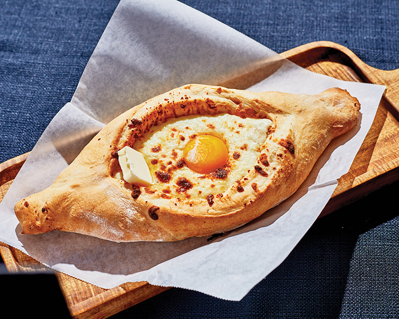 The Adjarian khachapuri's shape makes for the ideal vessel for this cheese, better, and egg pastry.