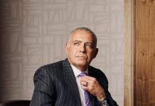 Hour Detroit Best Dressed List 2025: Tarek Sobh An academic leader, researcher, and roboticist, Tarek Sobh sports a Ralph Lauren suit coat with a Loro Piana button-up and a Versace tie. An Hermès belt holds up his Hugo Boss trousers — the cuff links are Ferragamo, as are the shoes.