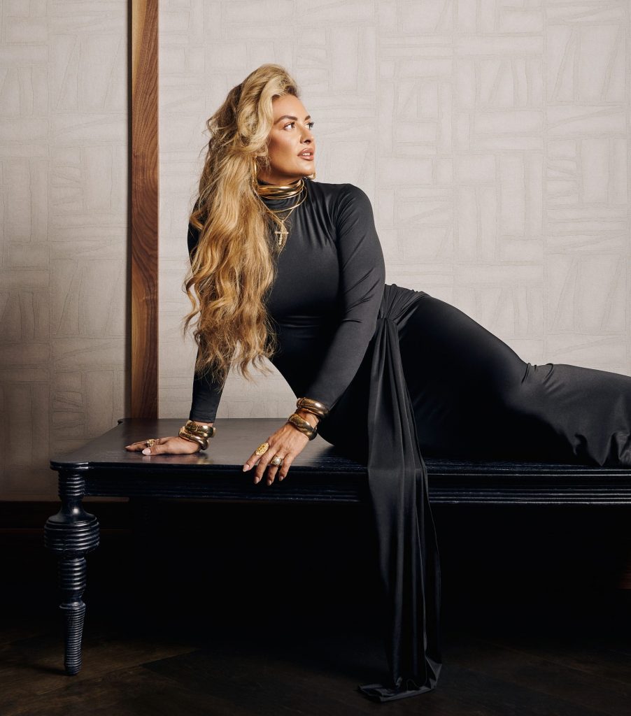 Katrina Malota, whose styling clients have included Eminem, 50 Cent, Robin Thicke, and Snoop Dogg, shows off her own style with an Amazon dress, earrings and a choker by Jennifer Fisher, plus additional jewelry from her collection. Not pictured are shoes from Fendi.