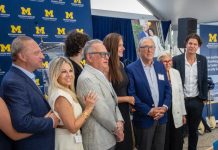 Michigan Medicine Opening New Facility on Site of Former Kmart HQ Kenneth Eisenberg (in blue suit, third from right) and family at the ground-breaking event in Troy.
