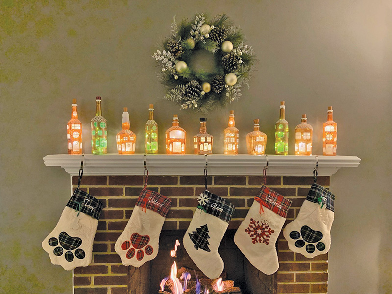 Spirited Lanterns "gingerbread-style" lanterns decorate a mantel for the holidays.