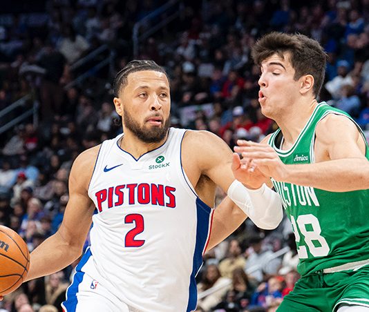 Cade Cunningham dribbling the ball down the court.