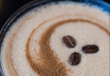 Top of an espresso martini with three espresso beans as a garnish