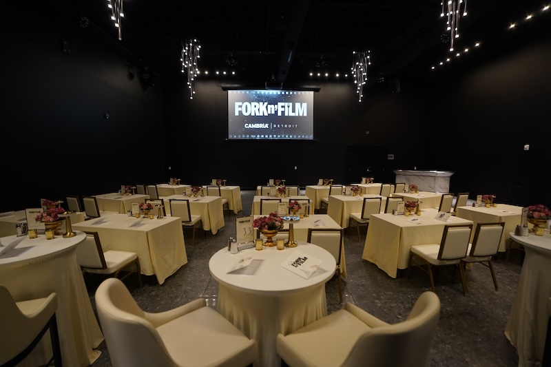 The dining room and screen at Fork N Film, one of several events featured in Metro Detroit dining news for November 2025