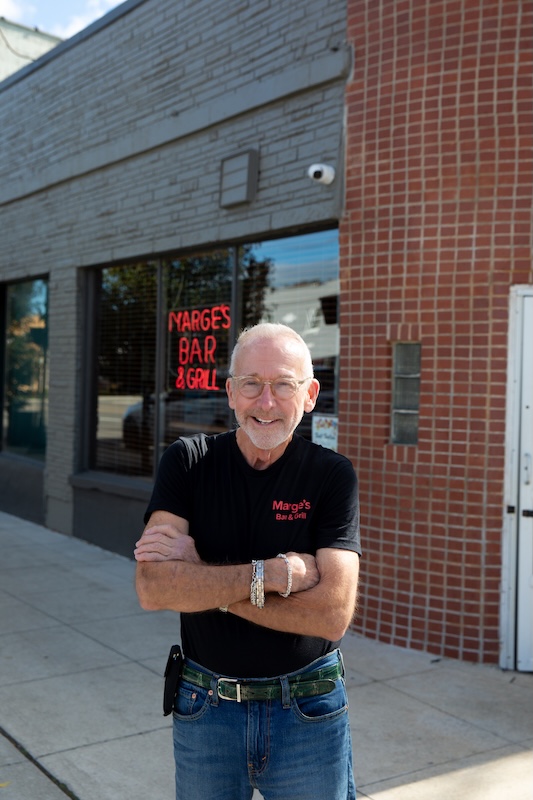 Restaurateur Charlie Brown poses by Marge's Bar in Grosse Pointe. One of many stories in Metro Detroit dining news for November 2025