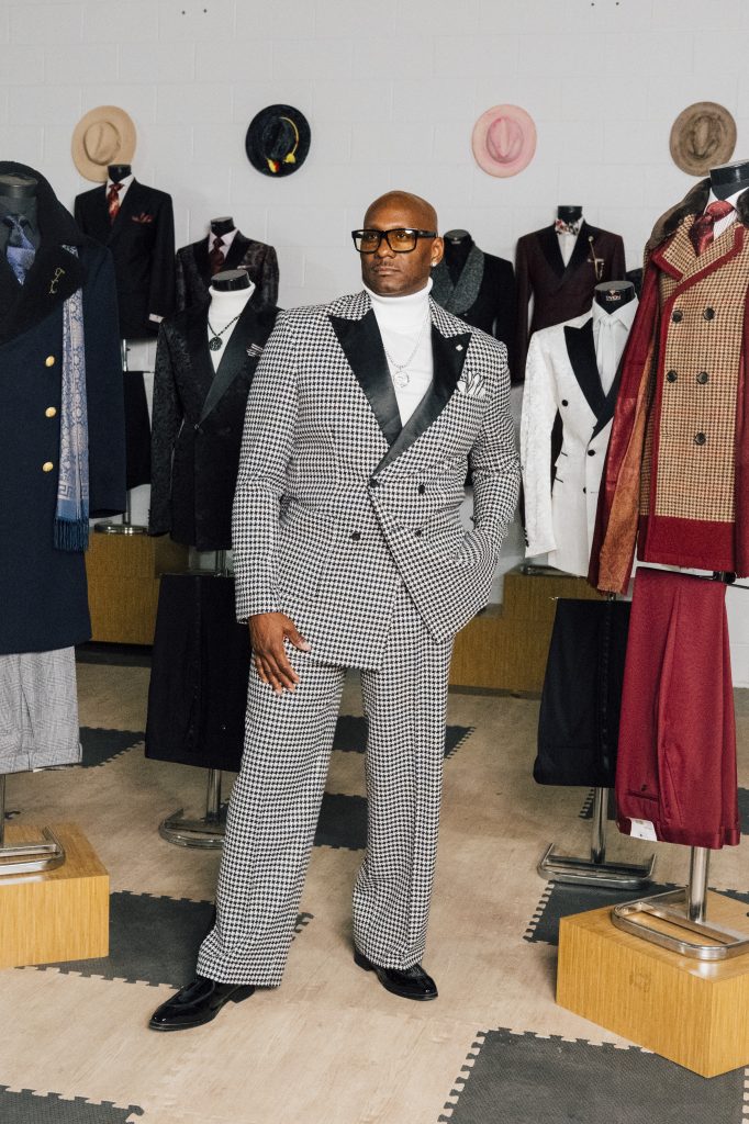 Montee Holland poses at his Tayion Collection warehouse in Taylor.