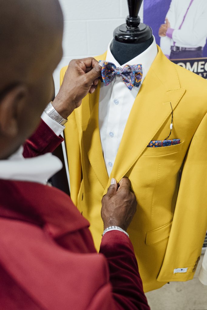 Montee Holland poses at his Tayion Collection warehouse in Taylor. 