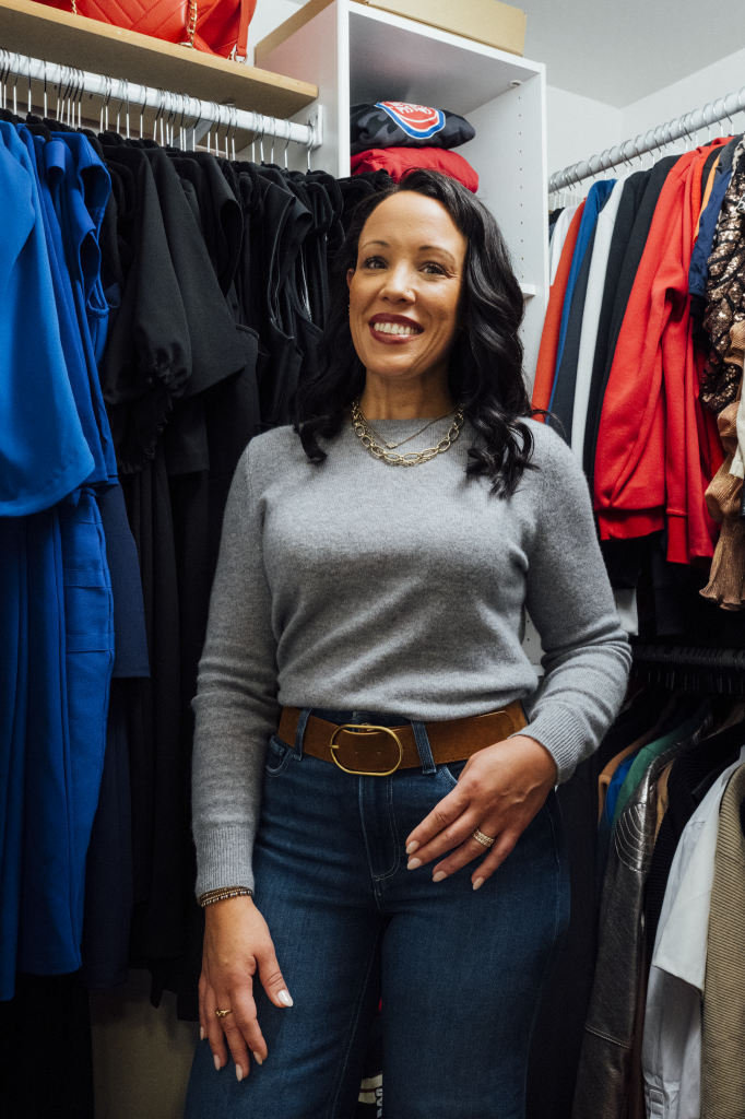 Andrea Walker-Leidy posing in an organized closet