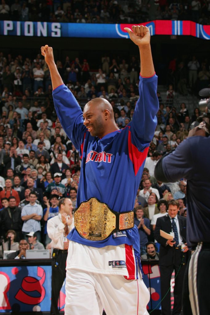 Elden Campbell wearing a championship belt.