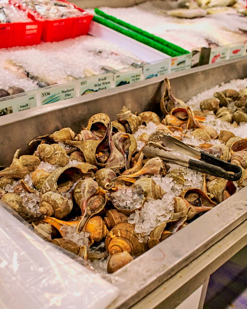 Live fish, fresh shellfish, and other specialty seafoods are imported from Asia and sold at the market. 