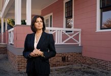 Patricia Mooradian stands outside the historic Jackson Home, the planning site for the 1965 Selma to Montgomery marches, which is now located in Greenfield Village.