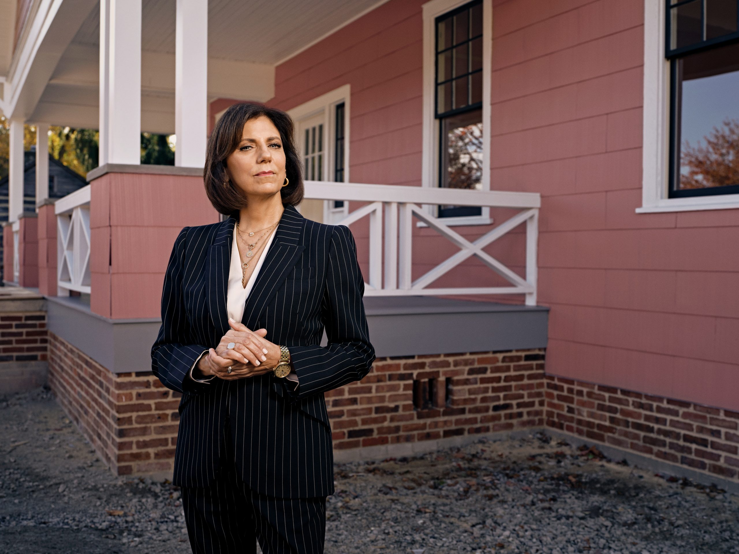 Patricia Mooradian stands outside the historic Jackson Home, the planning site for the 1965 Selma to Montgomery marches, which is now located in Greenfield Village.