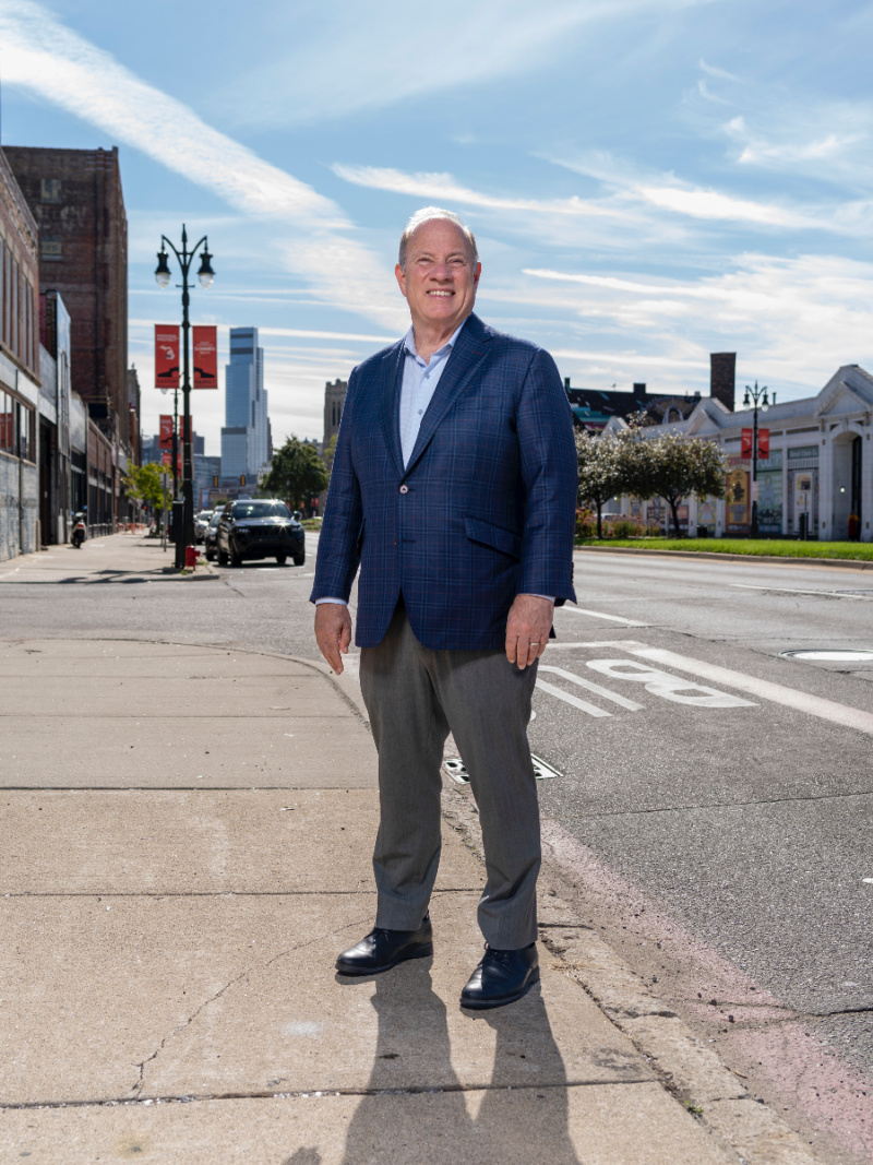 Detroit Mayor Mike Duggan standing on a sidewalk