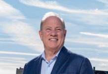Detroit Mayor Mike Duggan standing on a sidewalk