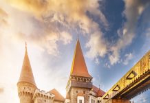 Bridge leading across moat to Corvin Castle in hunedoara at dawn