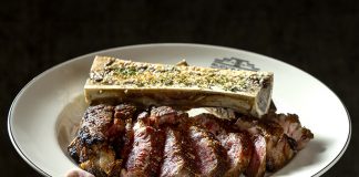 A steak plated with bone marrow.