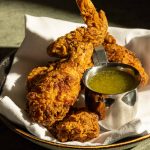 Fried chicken served with a pepper vinaigrette at Rudy's Prime Steakhouse