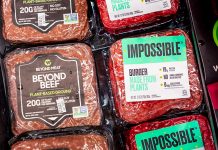 Impossible burger and Beyond Beef packages sold next to each other in a Gelson's Markets store; both products are plant based