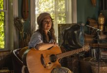 Audra Kubat on New Music, Her Life as a Detroit Singer-Songwriter Audra Kubat poses inside A Detroit House of Music, where she lives, hosts concerts and songwriting workshops, and tends to a community garden. Follow her on Instagram @audrakubat.