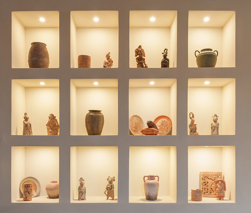 Mayan ceramic sculptures on display at Balam Coffee & Wine.
