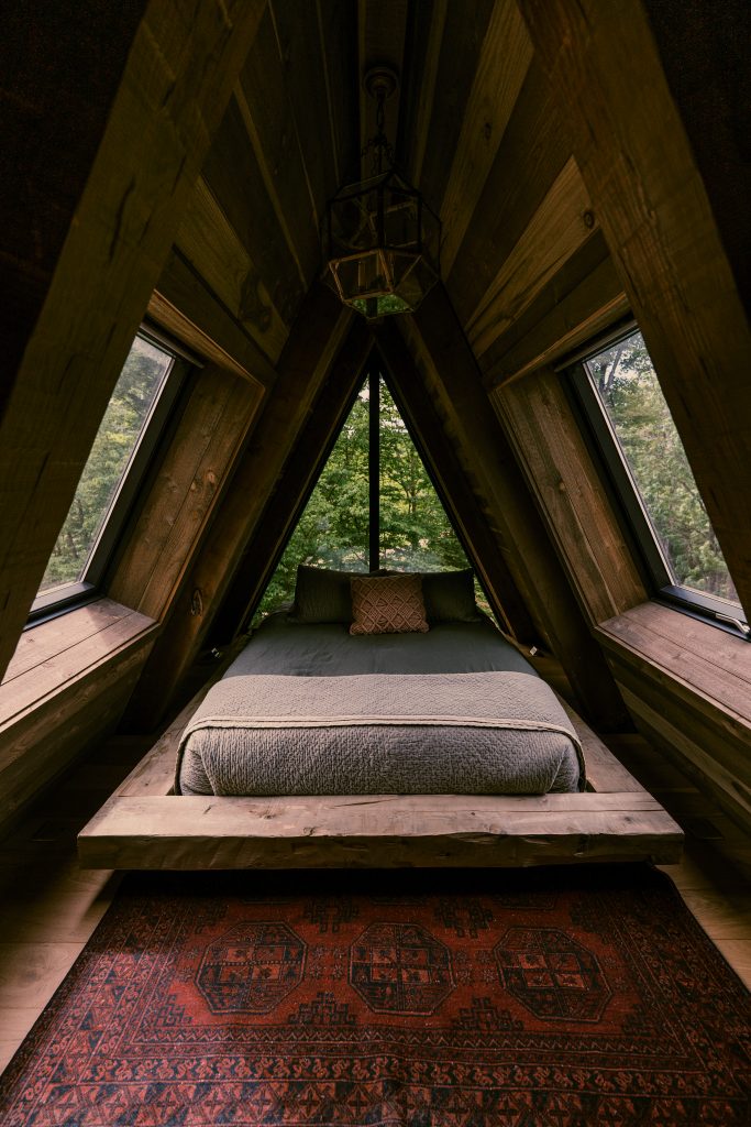 Take a ladder up to access this ultra-snug and scenic "hideaway" bedroom.