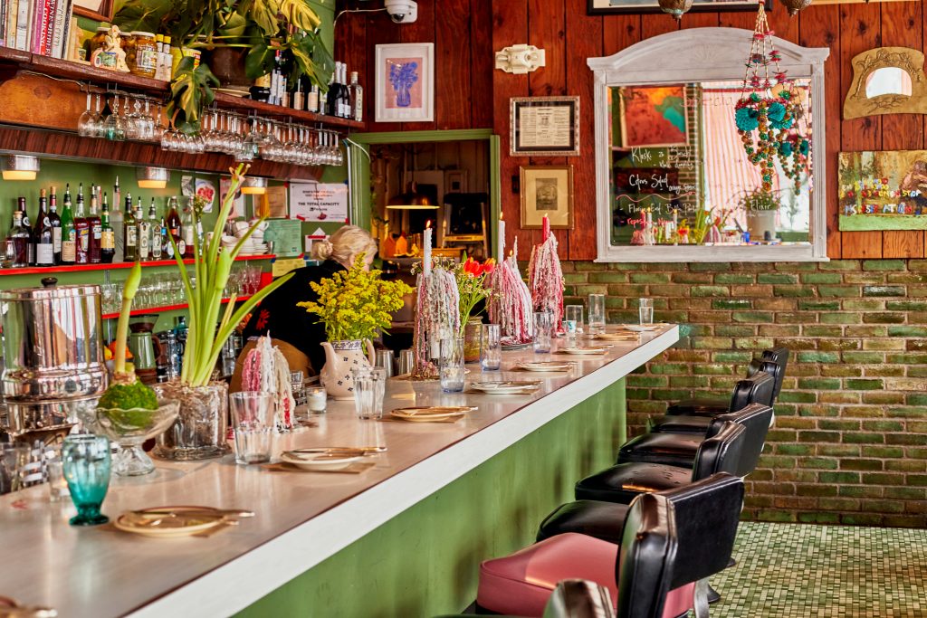 The bar at Rose's is a cozy place for a drink, like the Rosebuds cocktail or an old-fashioned. 