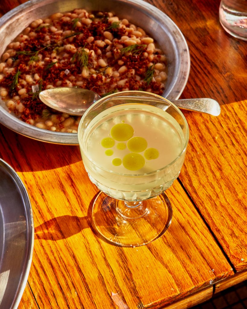 Navy beans with garlic breadcrumbs and herbs, plus a pickle martini.