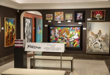 Paintings by Mark Kostabi on display
