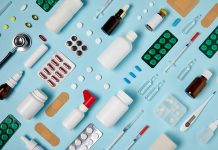 full frame shot of composed various medical supplies on blue surface