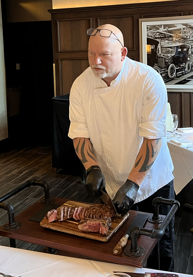 Chef Ernie Brown slicing The Cardinal